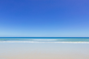 An empty beach during summer in Australia
