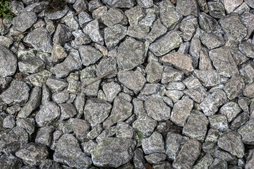 Detail of the pile of stones on the way with twig