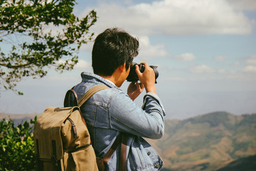 man carry a backpack and look somewhere on the moutain at Phu Lom Lo, Phetchabun, Thailand. . Feel freedom