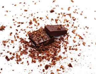 Pile chopped, milled chocolate with shavings isolated on white
