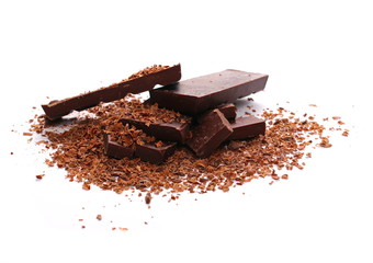 Pile chopped, milled chocolate with shavings isolated on white