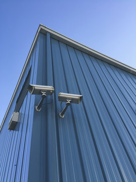 Surveillance cameras on building exterior