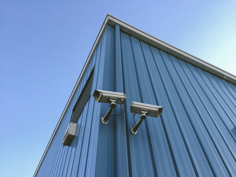 Surveillance cameras on building exterior
