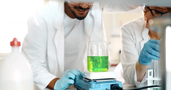 Attractive student of chemistry working in lab
