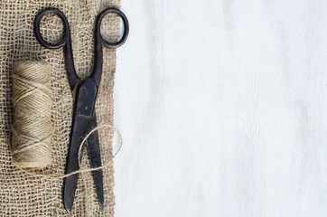 Old scissors, skein jute twine and burlap.