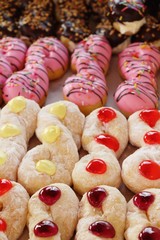 A lot of donut and strawberry jam