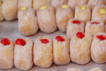 A lot of donut and strawberry jam