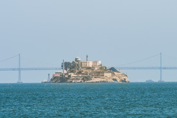 alcatraz island views with san francisco bridge at background