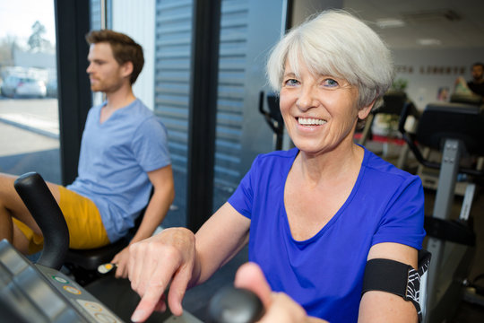 an elderly fit woman in the gym