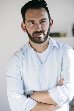 Portrait of businessman, looking at camera