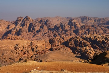 Fototapeta na wymiar landscape of Petra Valley, Red, orange and warm rocks in the capital city of the Nabataeans, Petra, Jordan
