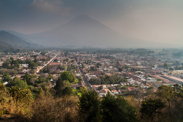 Aerial view of Antigua, Guatemala. Volcano Agua in the background.