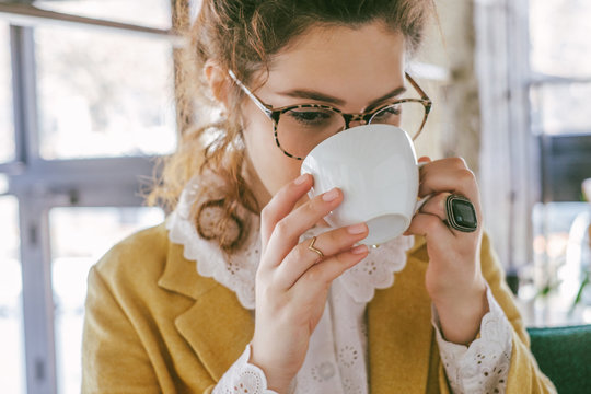 Stylish Young Woman Drinking Tea