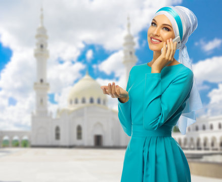 Muslim woman with white mosque