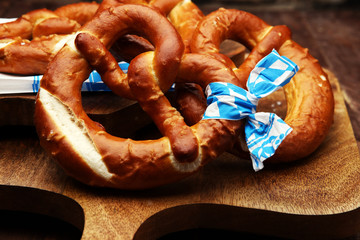 Pretzels on wooden board on rustic background. german food.