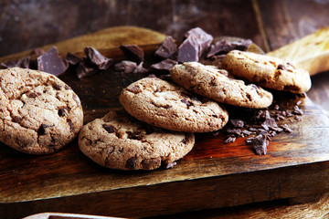 Chocolate cookies on wooden table. Chocolate chip cookies shot