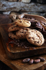 Chocolate cookies on wooden table. Chocolate chip cookies shot