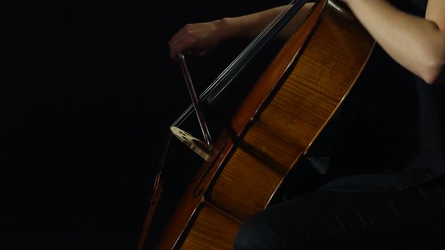 Professional cellist playing her instrument.