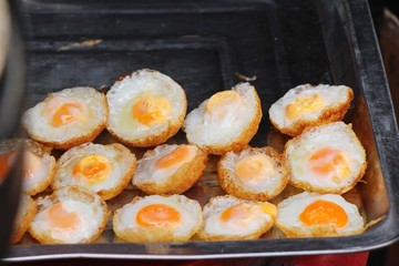 Quail eggs with sauce in street food