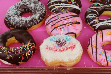 A lot of donut and strawberry jam