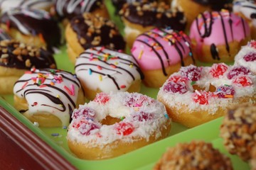 A lot of donut and strawberry jam