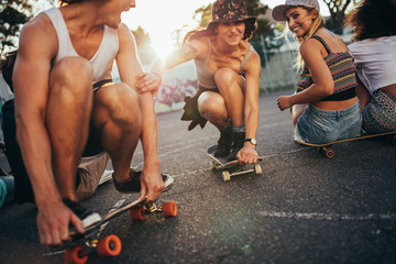 Friends with skateboards having fun