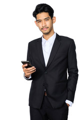 Young handsome asian business man using smartphone contact with partner while standing isolated white background,business people concept