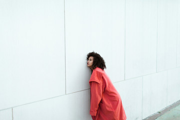 Young woman in a pink coat