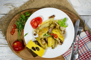 Baked potatoes at home. Potatoes on a white plate.