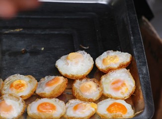 Quail eggs with sauce in street food