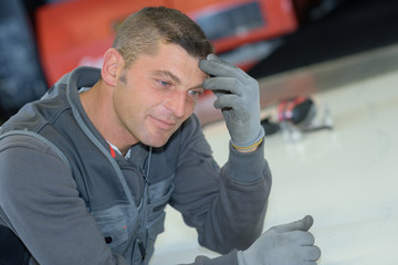 portrait of a male mechanic smiling