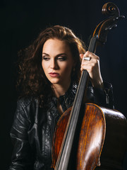 Beautiful cellist holding her cello © sumnersgraphicsinc