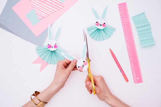 Woman Making Easter Bunny Rosettes As an Easter Decoration