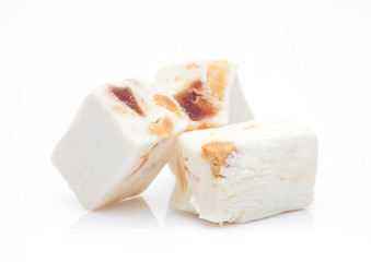 Nut nougat bar traditional sweet candy on white