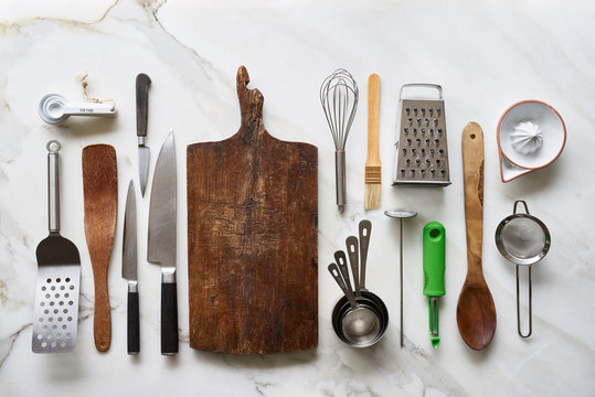 Different kitchenware tools on marble table