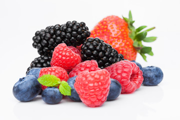 Fresh blueberry raspberry and blackberry with mint