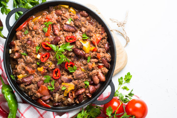 Chili con carne on white. Traditional mexican food. Top view.