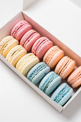 Colorful assorted macaroon cookies in a gift box