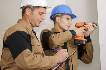 teacher grading the apprentice drill