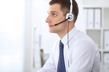 Young business man in headset. Call center