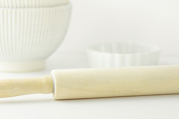 Wooden Rolling Pin White Baking Form Bowl on Table Pastry Holiday Cooking Bakery Concept Clean Minimalist Template for Poster Banner Copy Space Toned