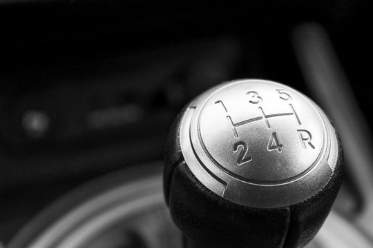 Abstract view of a gear lever, manual gearbox, car interior details. Black and white