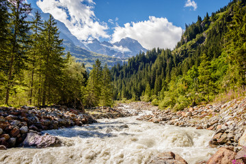 Obraz premium Spectacular white water river in the beautiful Lauterbrunnen valley which is a UNESCO world heritage 