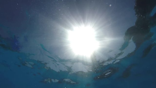 A woman jumps into the pool.
