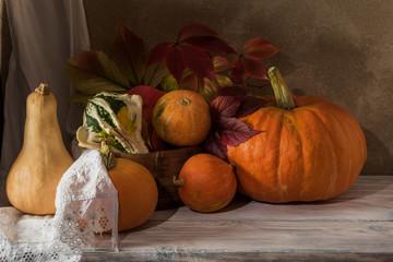 Harvest of pumpkins of different varieties on the table.