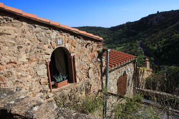 Traditional house in french village of Castelnou in Pyrenees orientales, France