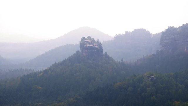 60fps timelapse. Sharp rocks hidden in valley full of heavy mist
Spring misty morning into magical landscape