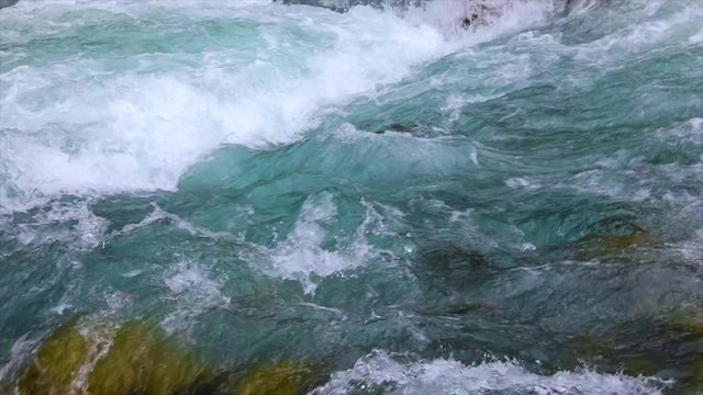 Mountain river water with slow motion closeup