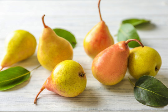 Ripe pears on wooden table