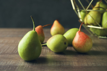 Ripe pears on wooden table